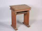 a small wooden table with a drawer underneath it