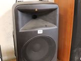two speakers that are sitting on a table