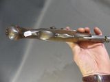 a person holding a metal object in their hand