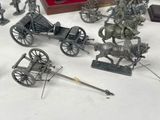 a lot of metal figurines that are on a table