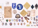 many different types of badges on a white surface