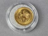 an image of a gold coin in a clear case