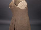 an image of a dress on a mannequin on a black background