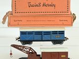 a toy train with a box on top of it