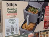 a box with a chicken in it on the shelf