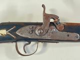 an old gun that is on display in a museum