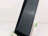 a cell phone that is sitting on top of a stand