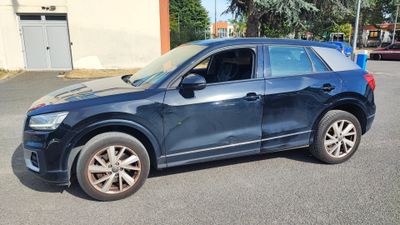 a picture of a blue suv parked in a parking lot