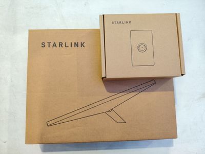 the box is open on a white surface with a starlink logo on it