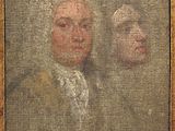 portrait of a man and a woman in a brown frame