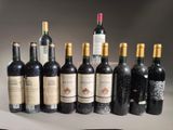 several bottles of wine are lined up in a row on a table