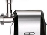 a meat grinder sitting on a white surface
