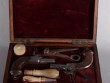 a wooden box with a set of tools inside of it