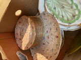 a box full of plates and bowls sitting on the floor