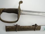 a sword and a dagger on display on a table