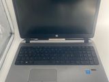 an open laptop computer sitting on top of a white table