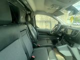 the interior of a car with the front seats folded down