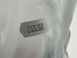 an image of a glass figurine of a woman with a name tag on it