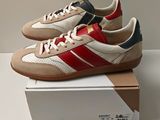 men ' s adidas sneakers with red, white, and blue stripes