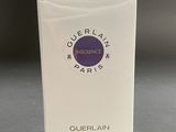 a box of perfume sitting on a table on a table