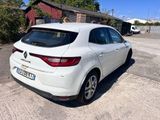 a picture of a white car parked in a parking lot