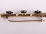 an image of a brass plated musical instrument on a white surface