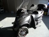 a scooter that is parked in a garage