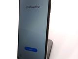 an image of a cell phone sitting on top of a stand
