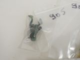 a plastic frog that is sitting on a plastic bag