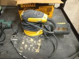 a corded sander and a corded sander on a table