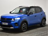 a blue suv parked in a room with a checkered floor