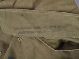 a close up of a military jacket with a label on it