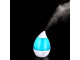 a blue and white humider with steam coming out of it