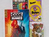 a lot of books and games on the table