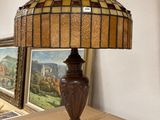 a lamp that is sitting on a table next to a picture