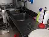 a kitchen with a sink and a stove in it
