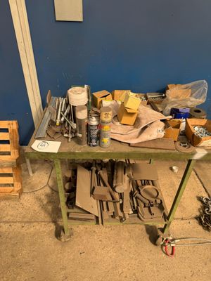 a workbench with tools on top of it in a room