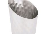 a silver cup that is sitting on a white surface