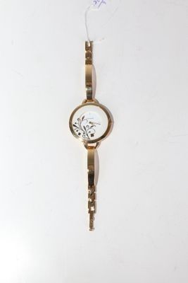 LASNIER. Montre bracelet de dame en métal doré, cadran blanc…