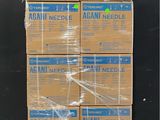 several boxes of aran needle are stacked on a pallet