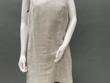 an image of a mannequin wearing a beige dress with black trims