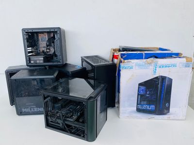 a lot of computer cases that are sitting on a table