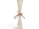 a glass vase with a red ribbon tied to it