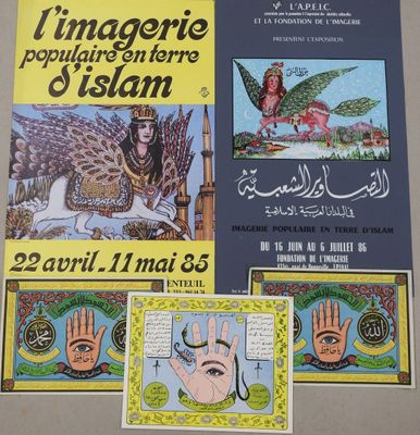 many religious posters on the wall of a building