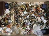 a box full of assorted jewelry and other items