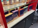 bottles of skin care products on a shelf in a store