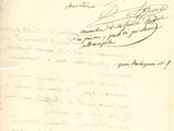 an old document with writing on it sitting on top of a table