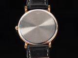 an image of a close up of a watch on a black background