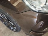 a close up of a car that has a denting on it