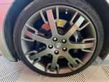 a close up of a tire on a car ' s rim